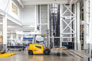 forklift in large steel building manufacturing facility